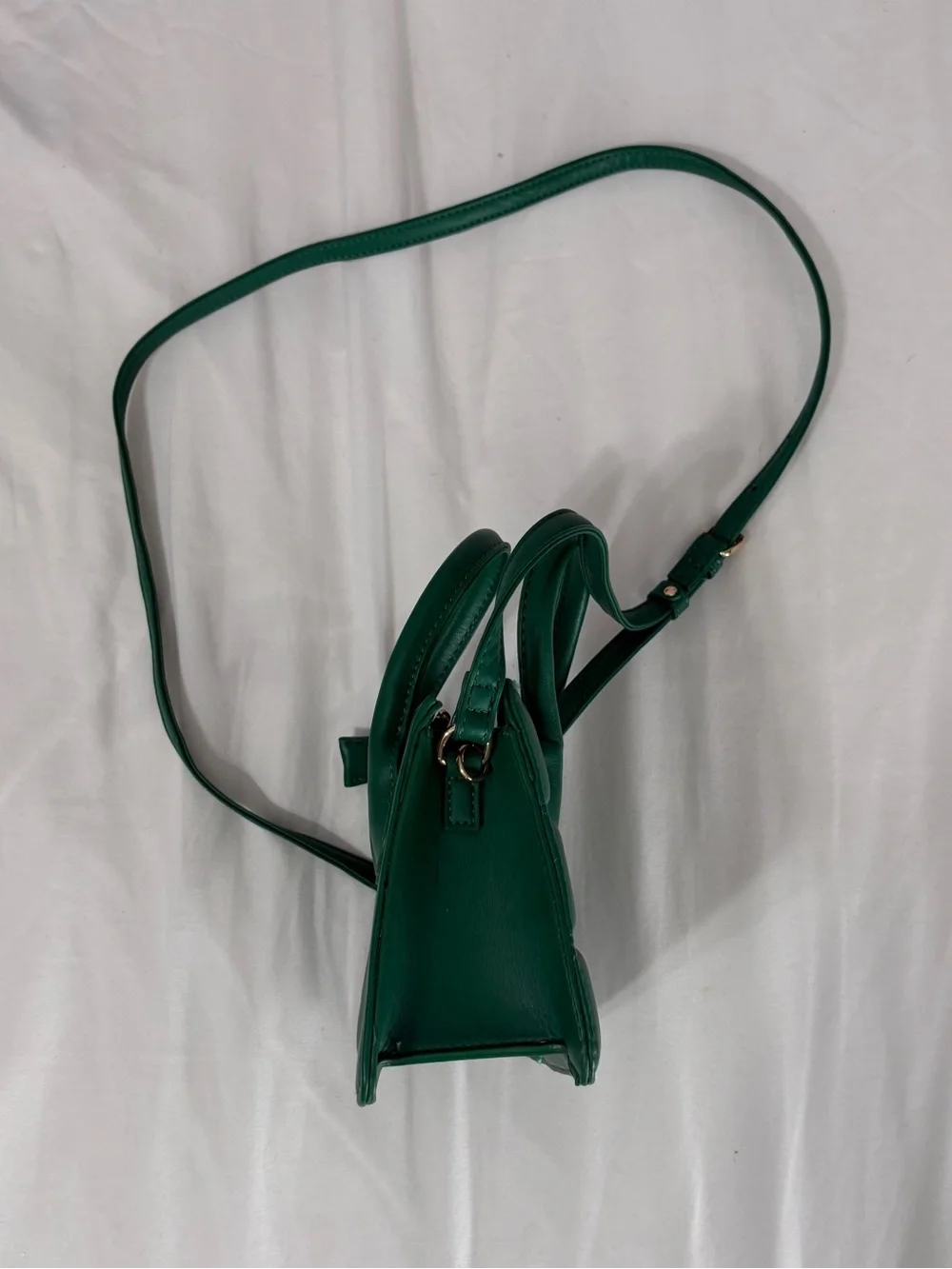 Green quilted mini handbag with removable adjustable crossbody strap